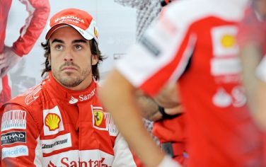 Ferrari driver Fernando Alonso of Spain looks on in the garage during the third free practice session of Formula One's Korean Grand Prix at Yeongam on October 23, 2010.  Alonso clocked the third fastest time in the final practice before qualifying for the Korean Grand Prix, which will be raced on October 24.   AFP PHOTO / PHILIPPE LOPEZ (Photo credit should read PHILIPPE LOPEZ/AFP/Getty Images)