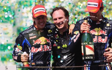 SAO PAULO, BRAZIL - NOVEMBER 07:  (L-R) Race winner Sebastian Vettel of Germany and Red Bull Racing, Red Bull Racing Team Principal Christian Horner and second placed Mark Webber of Australia and Red Bull Racing celebrate on the podium as Vettels win hands Red Bull Racing the Constructors Championship following the Brazilian Formula One Grand Prix at the Interlagos Circuit on November 7, 2010 in Sao Paulo, Brazil.  (Photo by Mark Thompson/Getty Images) *** Local Caption *** Mark Webber;Sebastian Vettel;Christian Horner