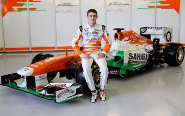NORTHAMPTON, ENGLAND - FEBRUARY 01:  Sahara Force India Formula 1 driver Paul Di Resta of Great Britain with the team's new car for the 2013 Formula 1 season, the VJM06, during the launch at the Silverstone circuit on February 1, 2013 in Northampton, England.  (Photo by Mark Thompson/Getty Images)