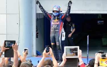 Red Bull driver Sebastian Vettel of Germany celebrates his victory in the Formula One Malaysian Grand Prix in Sepang on March 24, 2013.     AFP PHOTO / ROSLAN RAHMAN        (Photo credit should read ROSLAN RAHMAN/AFP/Getty Images)