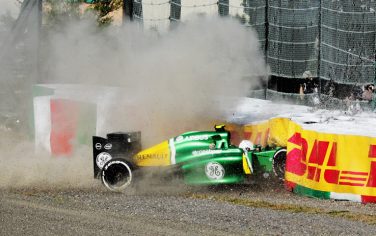 SUZUKA, JAPAN - OCTOBER 13:  Giedo van der Garde of the Netherlands and Caterham crashes out at the first corner at the start of the Japanese Formula One Grand Prix at Suzuka Circuit on October 13, 2013 in Suzuka, Japan.  (Photo by Ker Robertson/Getty Images)