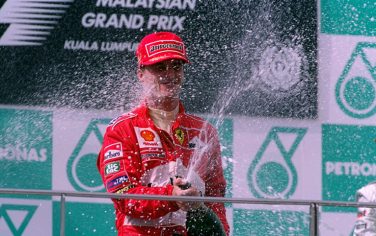 17 Oct 1999:  Ferrari's Eddie Irvine cracks open the champagne after winning the Formula One Malaysian Grand Prix at the Sepang Circuit in Kuala Lumpur, Malaysia.  \ Mandatory Credit: Mark Thompson /Allsport