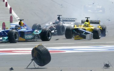 HOCKENHEIM, GERMANY - AUGUST 3:  Ralph Firman of Great Britain and Jordan collides with the remains of Kimi Raikkonen's accident during the Formula One German Grand Prix at Hockenheim on August 3, 2003 in Hockenheim, Germany. (Photo by Mark Thompson/Getty Images)