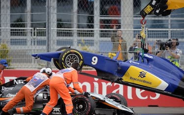 The cars of Sahara Force India F1 Team's German driver Nico Hulkenberg (front) and Sauber F1 Team's Swedish driver Marcus Ericsson are removed from the track during the Russian Formula One Grand Prix at the Sochi Autodrom circuit on October 11, 2015. AFP PHOTO / ALEXANDER NEMENOV        (Photo credit should read ALEXANDER NEMENOV/AFP/Getty Images)
