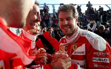 MELBOURNE, AUSTRALIA - MARCH 20: Sebastian Vettel of Germany and Ferrari celebrates in parc ferme with his team after the Australian Formula One Grand Prix at Albert Park on March 20, 2016 in Melbourne, Australia.  (Photo by Lars Baron/Getty Images)