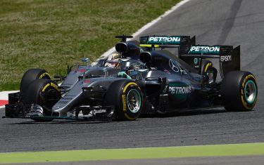 Mercedes AMG Petronas F1 Team's British driver Lewis Hamilton (L) and Mercedes AMG Petronas F1 Team's German driver Nico Rosberg lead after the start of the Spanish Formula One Grand Prix at the Circuit de Catalunya on May 15, 2016 in Montmelo on the outskirts of Barcelona. / AFP / LLUIS GENE        (Photo credit should read LLUIS GENE/AFP/Getty Images)