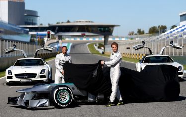 JEREZ DE LA FRONTERA, SPAIN - FEBRUARY 04:  Lewis Hamilton of Great Britain and Mercedes and Nico Rosberg of Germany and Mercedes unveil the new W04 car during the Mercedes GP F1 W04 Launch at Circuito de Jerez on February 4, 2013 in Jerez de la Frontera, Spain.  (Photo by Paul Gilham/Getty Images)