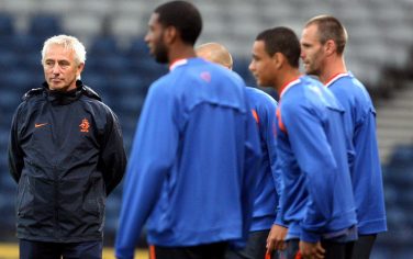Netherlands team coach  Bert van Marwijk, left, look's on at his players during their training session at Hampden Park, Glasgow, Scotland, Tuesday Sept. 8, 2009. Netherlands face Scotland in a World Cup group 9 qualifying soccer match on Wednesday. (AP Photo/Scott Heppell)