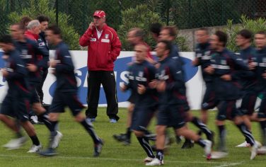 Italian national soccer team coach Marcello Lippi, center, leads a training session at La Borghesiana center in the outskirts of Rome, Tuesday, May 4, 2010. (AP Photo/Alessandra Tarantino)