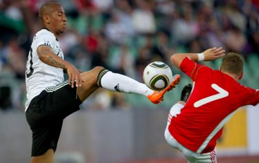 Jerome Boateng of Germany, left, and Balazs Dzsudzsak of Hungary, right, challenge for the ball during a friendly soccer match between Hungary and Germany in Budapest, Hungary, Saturday May 29, 2010. (AP Photo/Gero Breloer)