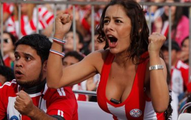 Paraguayan fans celebrate their team's first goal against Italy during a South Africa 2010 WCup soccer game, in downtown Asuncion, Monday June 14, 2010. (AP Photo/Jorge Saenz)