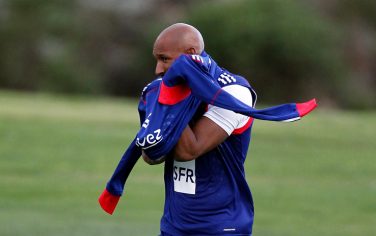 France forward Nicolas Anelka puts his training top on during a training session in Knysna, South Africa, Tuesday, June 8, 2010. France are preparing for the upcoming soccer World Cup, where they will play in Group A. (AP Photo/Francois Mori)