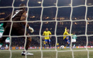 Brazil's Luis Fabiano, top, second from right, scores during the World Cup group G soccer match between Brazil and Ivory Coast at Soccer City in Johannesburg, South Africa, Sunday, June 20, 2010.  (AP Photo/Matt Dunham)
