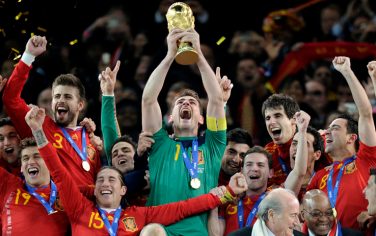 Spain goalkeeper Iker Casillas holds up the World Cup trophy after the World Cup final soccer match between the Netherlands and Spain at Soccer City in Johannesburg, South Africa, Sunday, July 11, 2010. Spain won 1-0. (AP Photo/Martin Meissner)