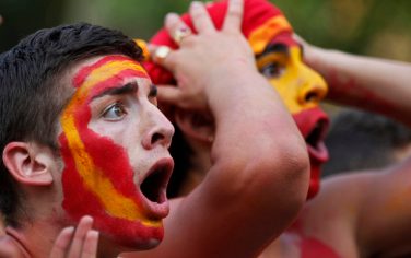 Spanish fans react during the live broadcast in Madrid of the World Cup soccer final between Spain and the Netherlands, which is being played in South Africa, on Sunday, July 11, 2010.(AP Photo/Armando Franca)