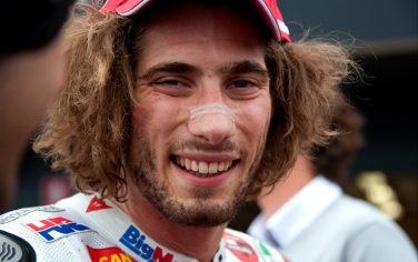 PHILLIP ISLAND, AUSTRALIA - OCTOBER 15: Marco Simoncelli of Italy and San Carlo Honda Gresini celebrates  at the end of the qualifying practice for the Australian MotoGP, which is round 16 of the MotoGP World Championship, at Phillip Island Grand Prix Circuit on October 15, 2011 in Phillip Island, Australia.  (Photo by Mirco Lazzari gp/Getty Images)