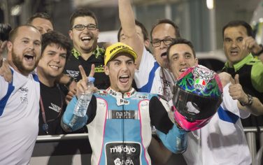 DOHA, QATAR - MARCH 20: Luis Salom of Spain and SAG Team
 celebrates with team under the podium at the end of the Moto2 race during the MotoGp of Qatar - Race at Losail Circuit on March 20, 2016 in Doha, Qatar. (Photo by Mirco Lazzari gp/Getty Images)