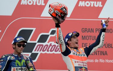 Spain's biker Marc Marquez (R) of Honda celebrates on the podium after winning the MotoGP race of the Argentina Grand Prix ahead of Italy's Valentino Rossi (L) of Yamaha at the Termas de Rio Hondo circuit, in Santiago del Estero, Argentina, on April 3, 2016.  AFP PHOTO / JUAN MABROMATA / AFP / JUAN MABROMATA        (Photo credit should read JUAN MABROMATA/AFP/Getty Images)