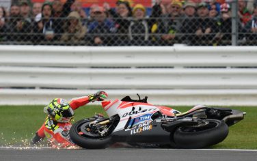 Ducati Team's Italian rider Andrea Iannone slides off the track during the MotoGP race at the motorcycling British Grand Prix at Silverstone circuit in Northamptonshire, southern England, on September 4, 2016.   / AFP / OLI SCARFF        (Photo credit should read OLI SCARFF/AFP/Getty Images)