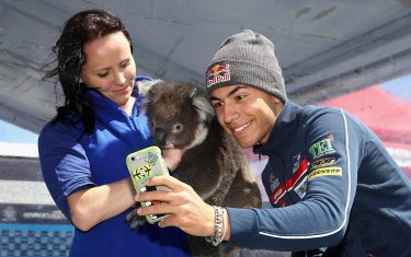 PHILLIP ISLAND, AUSTRALIA - OCTOBER 20:  Enea Bastianini of Italy and Gresini Racing Moto3 poses with a Koala during previews ahead of the 2016 MotoGP of Australia at Phillip Island Grand Prix Circuit on October 20, 2016 in Phillip Island, Australia.  (Photo by Cameron Spencer/Getty Images)