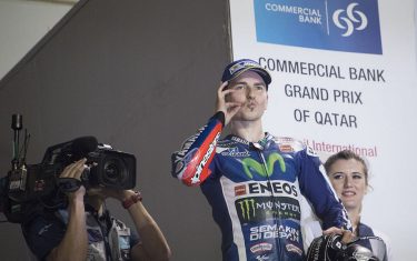 DOHA, QATAR - MARCH 20: Jorge Lorenzo of Spain and Movistar Yamaha MotoGP celebrates the victory n the podium at the end of the MotoGP race during the MotoGp of Qatar - Race at Losail Circuit on March 20, 2016 in Doha, Qatar. (Photo by Mirco Lazzari gp/Getty Images)