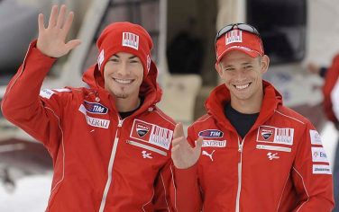 In this photo released by the Wroom 2010 photo service, Ducati Moto GP rider Nicky Hayden, left, of the United States, and Casey Stoner, of Australia, gesture as they arrive in Madonna di Campiglio, Italy, Sunday, Jan. 10, 2010. The Ducati and the Ferrari team are jointly meeting the media in this mountain resort of the Dolomites. (AP Photo/Ercole Colombo/HO) **EDITORIAL USE ONLY**