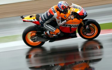Casey Stoner of Australia rides his Repsol Honda during the MotoGP motorcycle race during the  British Grand Prix at Silverstone racetrack on June 12, 2011 near Northampton. Stoner won the race with Andrea Dovizioso of Italy in second and Colin Edwards of the US in third. AFP PHOTO / ADRIAN DENNIS (Photo credit should read ADRIAN DENNIS/AFP/Getty Images)