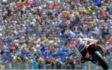 Spain's Dani Pedrosa of the Repsol Honda team steers his bike during the qualifying of the Moto Grand Prix at the Sachsenring Circuit on July 16, 2011 in Hohenstein-Ernstthal, eastern Germany. AFP PHOTO / ROBERT MICHAEL (Photo credit should read ROBERT MICHAEL/AFP/Getty Images)