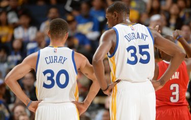 OAKLAND, CA - OCTOBER 4:  Stephen Curry #30 of the Golden State Warriors and Kevin Durant #35 of the Golden State Warriors talk during the game against the Los Angeles Clippers during a preseason game on October 4, 2016 at ORACLE Arena in Oakland, California. NOTE TO USER: User expressly acknowledges and agrees that, by downloading and or using this photograph, user is consenting to the terms and conditions of Getty Images License Agreement. Mandatory Copyright Notice: Copyright 2016 NBAE (Photo by Noah Graham/NBAE via Getty Images)