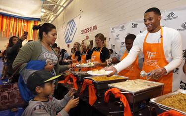 OKLAHOMA CITY, OK - NOVEMBER 15: NBA All-Star and Oklahoma City Thunder point guard, Russell Westbrook and hosts his 5th Annual Thanksgiving Dinner on November 15, 2016 at the Boys and Girls Club in Oklahoma City, Oklahoma. Westbrook and his Russell Westbrook Why Not? Foundation served over 950 meals. NOTE TO USER: User expressly acknowledges and agrees that, by downloading and or using this Photograph, user is consenting to the terms and conditions of the Getty Images License Agreement. Mandatory Copyright Notice: Copyright 2016 NBAE (Photo by Layne Murdoch/NBAE via Getty Images)