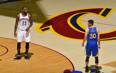 CLEVELAND, OH - JUNE 10:  LeBron James #23 of the Cleveland Cavaliers stands on the court with Stephen Curry #30 of the Golden State Warriors in Game Four of the 2016 NBA Finals on June 10, 2016 at Quicken Loans Arena in Cleveland, Ohio. NOTE TO USER: User expressly acknowledges and agrees that, by downloading and/or using this Photograph, user is consenting to the terms and conditions of the Getty Images License Agreement. Mandatory Copyright Notice: Copyright 2016 NBAE (Photo by Jesse D. Garrabrant/NBAE via Getty Images)