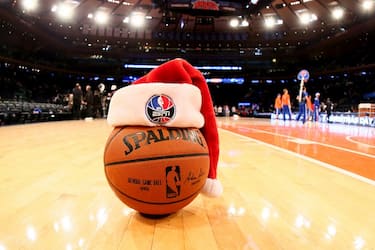 NEW YORK, NY - DECEMBER 25: The game ball on the court with a Santa hat before a game between the New York Knicks and the Washington Wizards at Madison Square Garden on December 25, 2014 in New York, New York. NOTE TO USER: User expressly acknowledges and agrees that, by downloading and/or using this Photograph, user is consenting to the terms and conditions of the Getty Images License Agreement. Mandatory Copyright Notice: Copyright 2014 NBAE (Photo by Nathaniel S. Butler/NBAE via Getty Images)