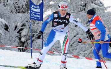 Arianna Follis of Italy in action on the final uphill climb to take the third place at the prestigious Tour de Ski, in Val di Fiemme, Italy, Sunday, Jan.10, 2010. (AP Photo/Armando Trovati)