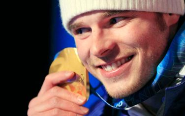 Italy's Giuliano Razzoli celebrates after receiving the gold medal in the men's slalom during the medal ceremony of the Vancouver 2010 Olympics in Whistler, British Columbia, Saturday, Feb. 27, 2010. (AP Photo/Andrew Medichini)