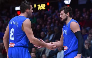 Italy's small forward Danilo Gallinari (L) and Italy's small forward Alessandro Gentile greet while substituting during the round of 16 basketball match between Israel and Italy at the EuroBasket 2015 in Lille, northern France, on September 13, 2015.  AFP PHOTO / PHILIPPE HUGUEN        (Photo credit should read PHILIPPE HUGUEN/AFP/Getty Images)
