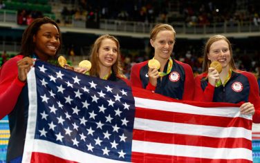 RIO DE JANEIRO, BRAZIL - AUGUST 13:  Kathleen Baker, Lilly King, Dana Vollmer, Simone Manuel of the United States pose during the medal ceremony for the Women's 4 x 100m Medley Relay Final on Day 8 of the Rio 2016 Olympic Games at the Olympic Aquatics Stadium on August 13, 2016 in Rio de Janeiro, Brazil.  (Photo by Clive Rose/Getty Images)