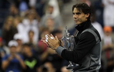 NEW YORK - SEPTEMBER 13:  Rafael Nadal of Spain holds the championship trophy during the trophy ceremony after defeating Novak Djokovic of Serbia to win the men's singles final on day fifteen of the 2010 U.S. Open at the USTA Billie Jean King National Tennis Center on September 13, 2010 in the Flushing neighborhood of the Queens borough of New York City.  (Photo by Chris McGrath/Getty Images) *** Local Caption *** Rafael Nadal