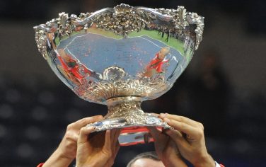 Serbian team members hold up the Davis Cup after winning the last singles Davis Cup tennis match finals between Serbia and France, at Belgrade Arena on December 5 , 2010. AFP PHOTO / DIMITAR DILKOFF (Photo credit should read DIMITAR DILKOFF/AFP/Getty Images)
