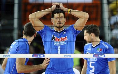 Italy's Luigi Mastrangelo (C) reacts among teammates during their Volleyball World Championships semifinal match against Brazil in Rome's Palalottomatica on October 9, 2010. Brazil won the match 3-1 and will advance to the final against Cuba.   AFP PHOTO / Filippo MONTEFORTE (Photo credit should read FILIPPO MONTEFORTE/AFP/Getty Images)