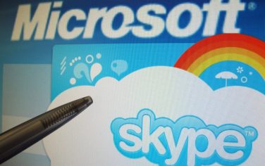 epa02725538 A ballpen points to a screen showing the logos of US software company Microsoft and internet phone service Skype, Berlin, Germany 10 May 2011. According to media reports 10 May, Microsoft is close to a deal to buy Skype.  EPA/Franz-Peter Tschauner