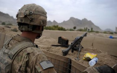 A US soldier of Bravo Company 2/508th PIR, 4th BTC, 82 Airborne (Air Assault) stands guard at an under-construction base in Kandahar province's Kukaran on August 5, 2010. Amid growing US discontent over the war in Afghanistan, President Barack Obama defended the conflict August 2, saying progress was being made towards important security goals. AFP PHOTO/ Yuri CORTEZ (Photo credit should read YURI CORTEZ/AFP/Getty Images)