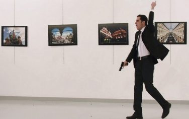 EDITORS NOTE: Graphic content / A picture taken on December 19, 2016 shows Mevlut Mert Altintas, the gunman who killed Russia's Ambassador to Turkey, during an attack during a public event in Ankara.A gunman crying "Aleppo" and "revenge" shot Karlov while he was visiting an art exhibition in Ankara on December 19, witnesses and media reports said. The Turkish state-run Anadolu news agency said the gunman had been "neutralised" in a police operation, without giving further details.  / AFP / Sozcu daily / Yavuz Alatan        (Photo credit should read YAVUZ ALATAN/AFP/Getty Images)