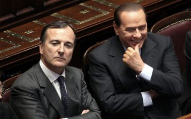ROME - DECEMBER 14:  Italian Prime Minister Silvio Berlusconi (R), flanked by foreign minister Franco Frattini smile during the confidence vote to his government at the Lower house on December 14, 2010 in Rome, Italy. Italian Prime Minister Silvio Berlusconi faced a vote of no confidence from both the Senate and the Lower House but won both counts.  (Photo by Franco Origlia/Getty Images) *** Local Caption *** Silvio Berlusconi;Franco Frattini
