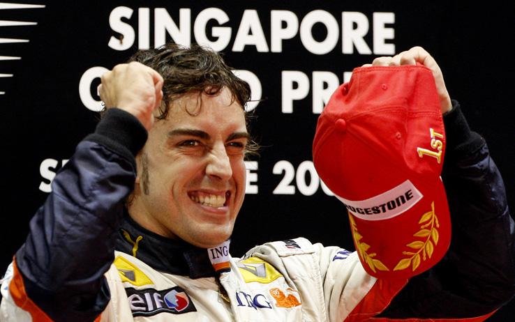 FILE - In this Sunday Sept. 28 2008 file photo, Renault Formula One auto racing driver Fernando Alonso of Spain reacts after winning the Singapore Formula One Grand Prix on the Marina Bay City Circuit in Singapore. On Wednesday, Sept. 16, 2009, Renault said managing director Flavio Briatore and engineering chief executive Pat Symonds are leaving the Formula One team, and that it will not dispute charges that Nelson Piquet Jr. was ordered to crash in a race. Renault has been summoned to Paris by governing body FIA to answer a charge that Piquet Jr. was told to crash at last year's Singapore Grand Prix to improve teammate Fernando Alonso's chances of victory. The Spaniard won the race. Renault said it will not dispute the recent allegations made by the FIA concerning the 2008 Singapore Grand Prix. (AP Photo/Vincent Thian, File)