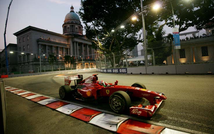 epa01874110 Finnish Formula One driver Kimi Raikkonen of Scuderia Ferrari steers his car during the first practice session at the Marina Bay Street Circuit in Singapore, 25 September 2009. The Formula One Grand Prix of Singapore will take place on 27 September 2009.  EPA/DIEGO AZUBEL