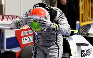 epa01834835 Brazilian Formula One driver Rubens Barrichello of Brawn GP celebrates after winning the Grand Prix of Europe at the Valencia Street Circuit in Valencia, Spain, 23 August 2009.  Rubens Barrichello in a Brawn GP drove a perfect race 23 August to win the European Grand Prix at the Valencia street circuit and register his first Formula One victory in almost
five years. Defending world champion Lewis Hamilton claimed second spot for McLaren-Mercedes, followed by Kimi Raikkonen in a Ferrari and Heikki
Kovalainen in the second McLaren.  EPA/VALDRIN XHEMAJ