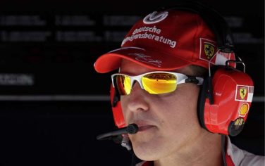 epa01833360 German Michael Schumacher, former Formula One World Champion and consultant of Scuderia Ferrari, is seen at the team's gantry during the qualifying session of the Grand Prix of Europe at the Valencia Street Circuit in Valencia, Spain, 22 August 2009. The Grand Prix of Europe will take place on Sunday, 23rd August 2009.  EPA/VALDRIN XHEMAJ