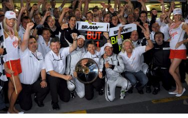 epa01680729 Brawn GP owner Ross Brawn (floor-L), Brawn GP's CEO Nick Fry (floor 2-L), British Formula One driver Jenson Button (floor 3-L), Brazilian teammate Rubens Barrichello (floor 3-R) and Virgin Group's Sir Richard Branson (floor 2-R) celebrate with Brawn team members after winning first and second place in the Australian Formula 1 Grand Prix at the Albert Park Circuit in Melbourne, Australia, 29 March 2009. Button finished first followed by Barrichello in second and Italian Formula One driver Jarno Trulli of Toyota finished third.  EPA/PETER STEFFEN