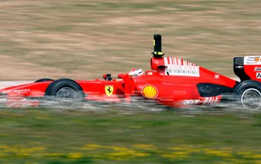 Ferrari's Finnish F1 driver Kimi Raikkonen steers his car during a test session at the Catalonia racetrack in Montmelo, near Barcelona, Spain, Monday, March 9, 2009. (AP Photo/Manu Fernandez)