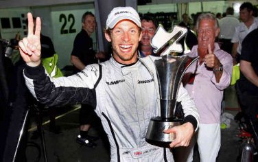 epa01688792 British Formula One driver Jenson Button of Brawn GP celebrates with his trophy inside the team's garage after winning the Malaysian Grand Prix at the Sepang circuit, outside Kuala Lumpur, Malaysia, 05 April 2009. Button won the race followed by German Formula One driver Nick Heidfeld of BMW Sauber in second place and German Formula One driver Timo Glock of Toyota in third. The race was interrupted after 33 laps due of heavy rain.  EPA/AHMAD YUSNI